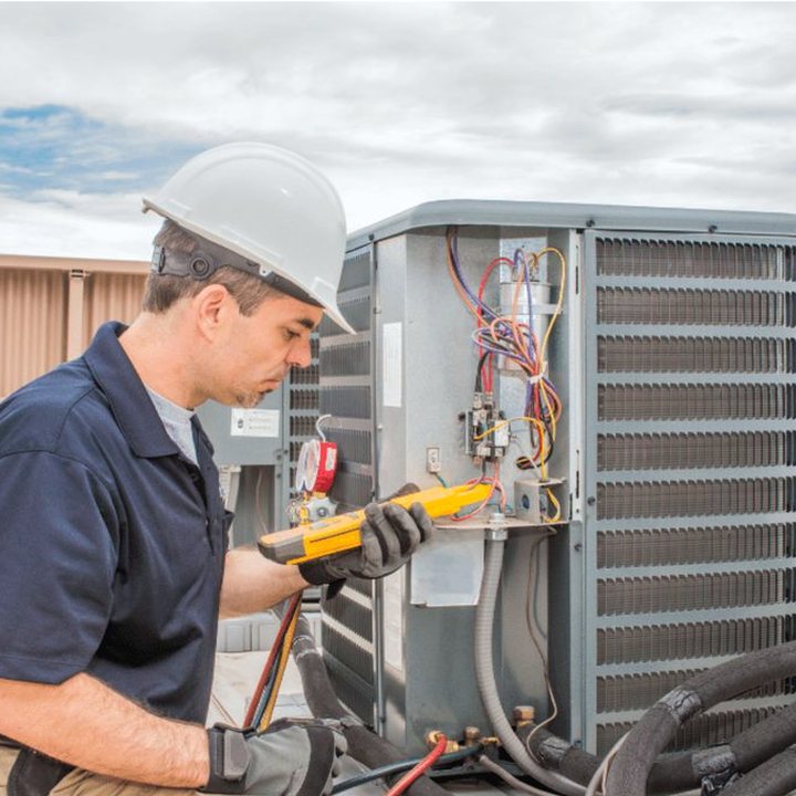 Wingham Heating & Cooling HVAC technician on a service call in Wingham, Ontario
